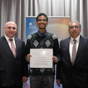 Photo of Aqshems Nichols accepting his award at the CUTC banquet.